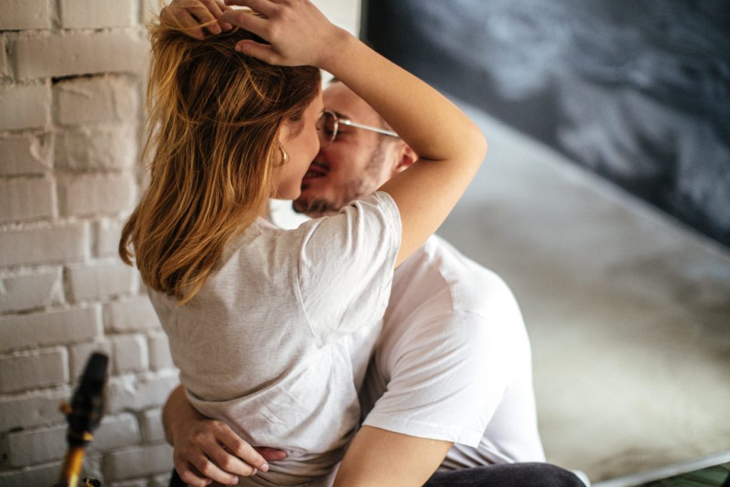 Couple Embracing in Bed