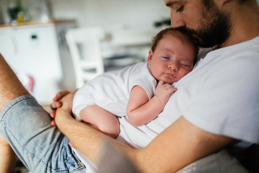 Baby Sleeping on Man's Lap
