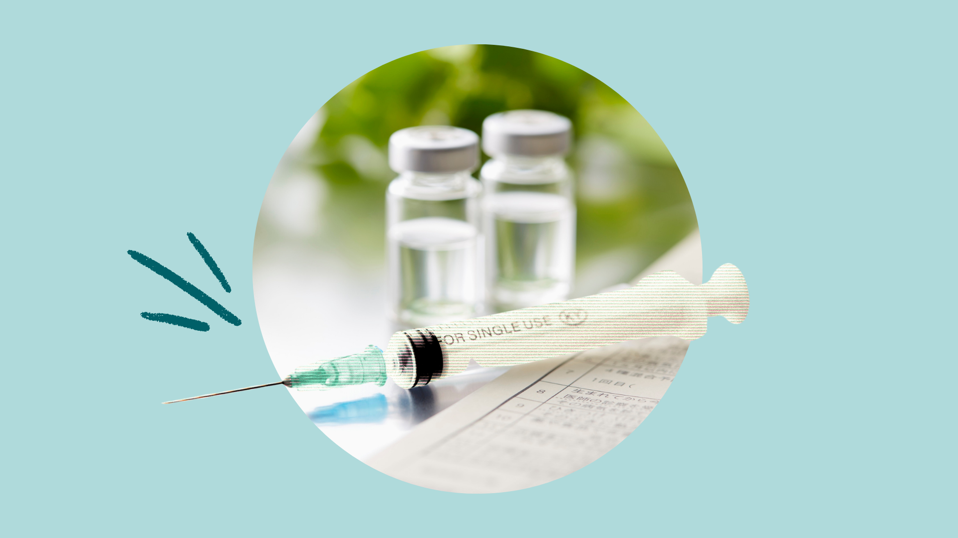 A syringe in front of two vials